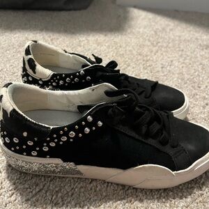 Size 7 Dolce Vita slip on sneakers. Only worn a few times still good condition